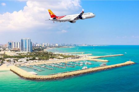 A-Top-View-Of-Kish-Island-And-An-Earplane-Passing-Through-The-Sky- A-Top-View-Of-Kish-Island-And-An-Earplane-Passing-Through-The-Sky-