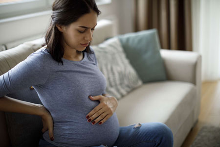 درد زیر شکم در بارداری, علت درد زیر شکم در اوایل بارداری, علت درد زیر شکم در بارداری